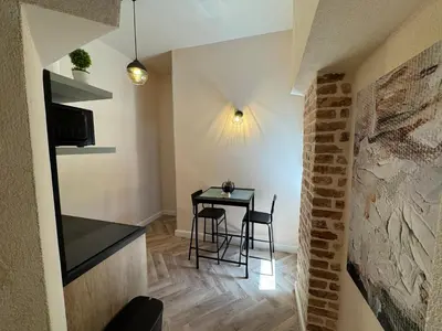 a small dining room with a table and chairs at Apartments Marilu in Kotor