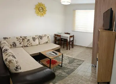 a living room with a couch and a table at TEA7 apartment in Kotor
