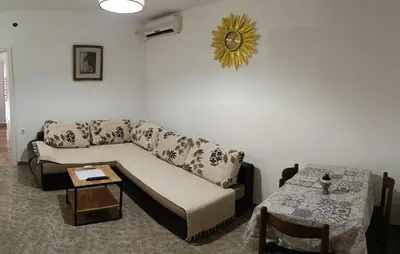 a living room with a couch and a table at TEA7 apartment in Kotor
