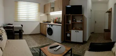 a room with a kitchen and a living room at TEA7 apartment in Kotor