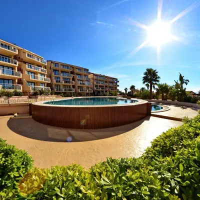 a swimming pool in the middle of a resort at Montetrest Apartments in Sveti Stefan