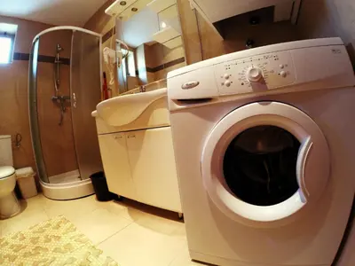 a washer and dryer in a small bathroom at Montetrest Apartments in Sveti Stefan
