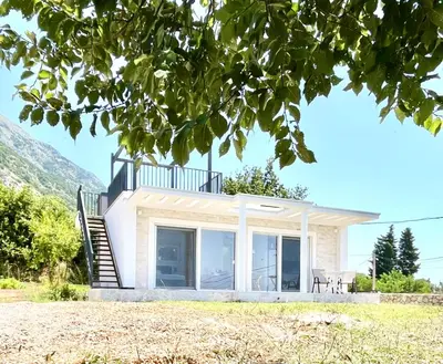 a house with a staircase to the roof at Bungalow for 2 - Dream Oasis Dobra Voda in Dobra Voda