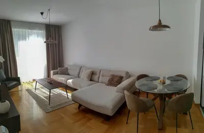 a living room with a couch and a table at Apartments Radovic in Podgorica