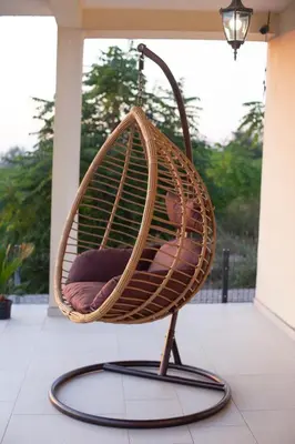 a hanging basket chair on a porch at Sunset house in Višnjevo