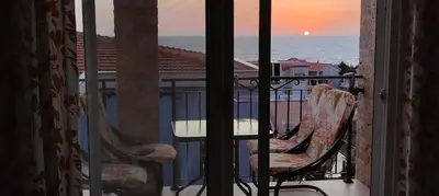 a view of the ocean from a balcony with two chairs at Apartment Blue Utjeha Hladna uvala in Kruče