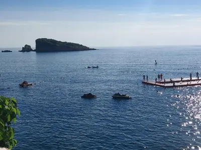 a group of people standing on a dock in the water at Apartment Blue Utjeha Hladna uvala in Kruče