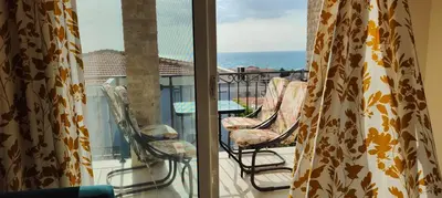 a balcony with chairs and a view of the ocean at Apartment Blue Utjeha Hladna uvala in Kruče