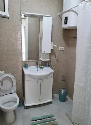 a bathroom with a toilet and a sink and a mirror at Apartment Blue Utjeha Hladna uvala in Kruče