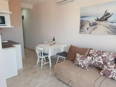 a living room with a couch and a table at Stadjorluk Hladna uvala in Kruče