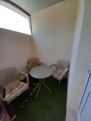 a small room with a table and two chairs at apartman19 in Podgorica