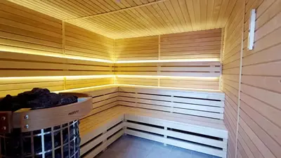 a sauna with a basket in the middle of it at Olive Tree Apartments in Becici