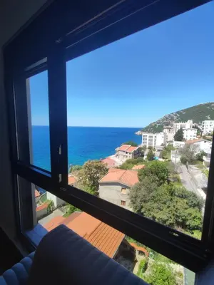 a view of the ocean from a window at SD LUX APARTMENTS in Dobra Voda