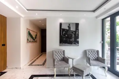 a dining room with two chairs and a table at Elia Suites in Becici