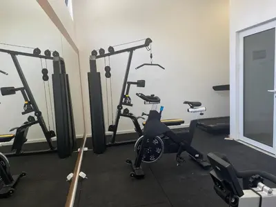 a gym with several exercise bikes in a room at Elia Suites in Becici