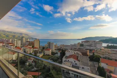 a view of a city from a balcony at Elia Suites in Becici
