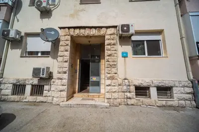 a building with a door in the side of it at center_apartment_LUX in Podgorica