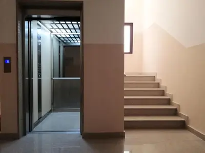 a hallway with stairs in a building at Apartment Anatolia of Becici in Becici