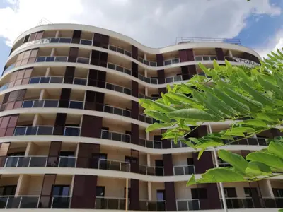 a building with green leaves in front of it at Apartment Anatolia of Becici in Becici
