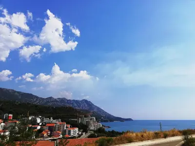 a view of a city and the ocean at Apartment Anatolia of Becici in Becici