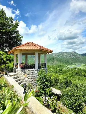 a gazebo on a hill with a view at Sunny Side Apartments in Rijeka Crnojevića