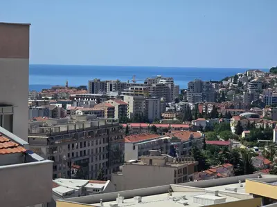 a view of a city with buildings and the ocean at LaMar in Budva