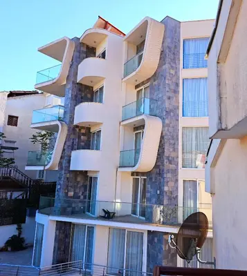a building with balconies on the side of it at Apartman Bravo Budva in Budva