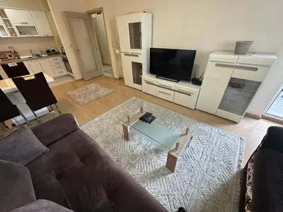 a living room with a couch and a coffee table at Hanna apatment in Podgorica