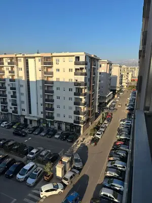 a parking lot with cars parked in a parking lot at Hanna apatment in Podgorica