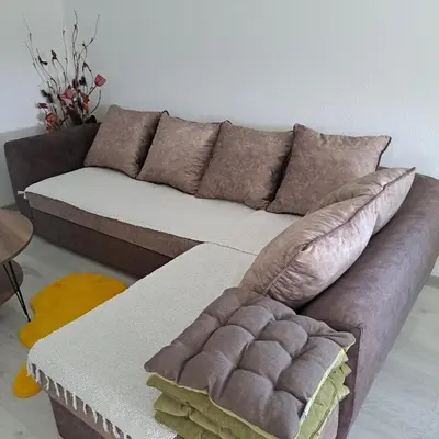 a living room with a couch and a table at Knežević apartman in Podgorica