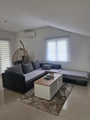 a living room with a couch and a coffee table at Knežević apartman in Podgorica