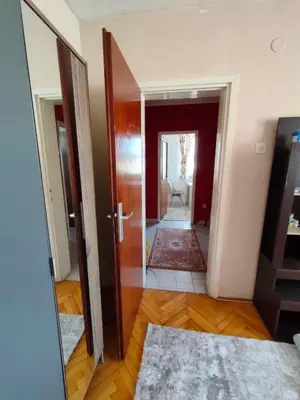 a hallway with a door leading to a living room at Lepa Kata Centar in Podgorica