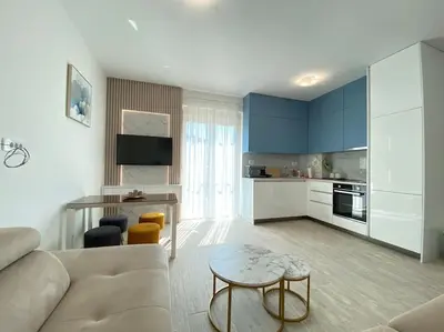 a living room with a couch and a table at Becici - apartment Majestic in Budva