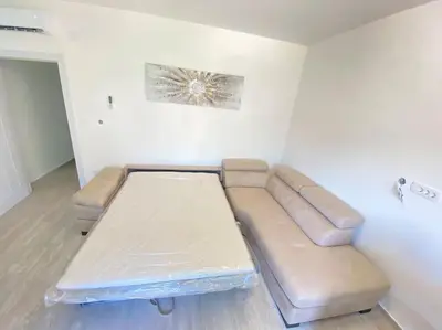 a living room with a couch and a table at Becici - apartment Majestic in Budva