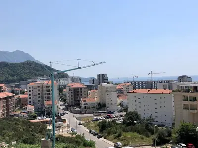 a view of a city with buildings and a street at Becici - apartment Majestic in Budva