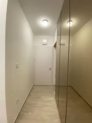 a hallway with a glass door and a walk in shower at Becici - apartment Majestic in Budva
