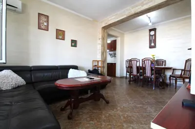 a living room with a couch and a table at 2bd Apt w Private Pool and City View 