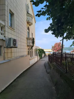 a building with a air conditioner on the side of it at Черногория Квартира у моря in Rafailovici