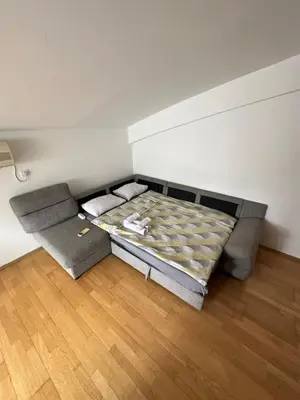 a room with a bed in the corner of a room at Stex Urban 3 in Podgorica