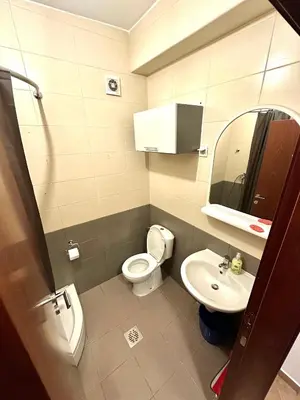 a small bathroom with a toilet and a sink at Stex Urban 3 in Podgorica