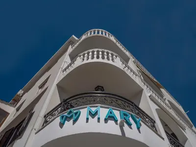 a may sign on the side of a building at Apartments Mary in Budva