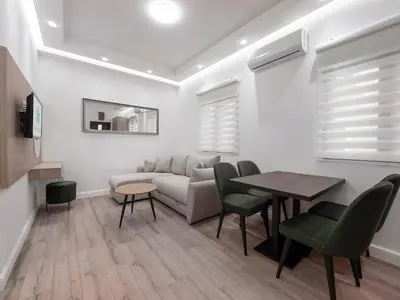 a living room with a couch and a table at Apartments Mary in Budva