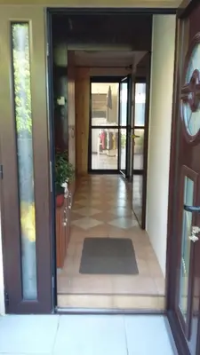 a hallway of a house with a door open at Apartments Krivokapic in Kotor