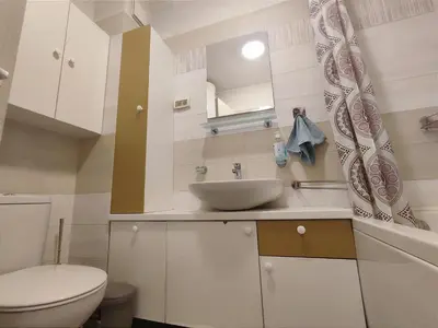 a bathroom with a sink and a toilet at CITY POINT Apartment in Podgorica