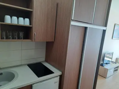 a kitchen with a sink and a counter top at Apartments Val in Dobra Voda