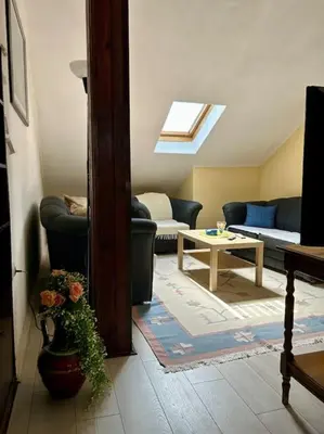 a living room with a couch and a table at Central Park Apartment in Podgorica