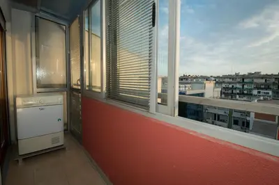 an apartment balcony with a view of a city at City Nest apartment in Podgorica
