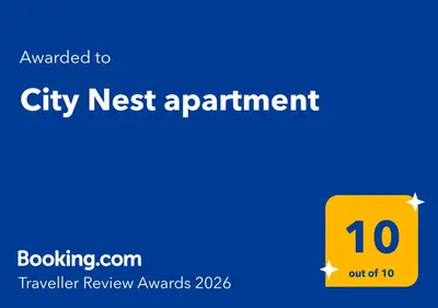 a yellow sign that says city next appointment at City Nest apartment in Podgorica