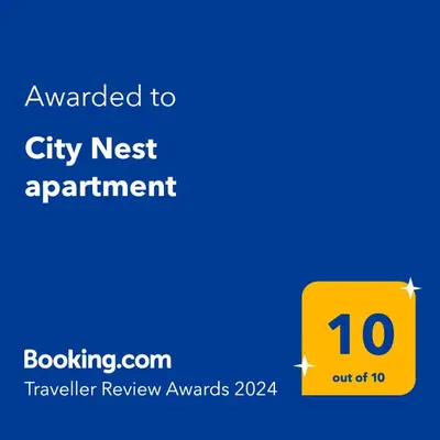 a yellow sign with the text wanted to city next appointment at City Nest apartment in Podgorica