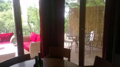 a view of a patio with a table and chairs at Holiday House Villa Neda in Utjeha
